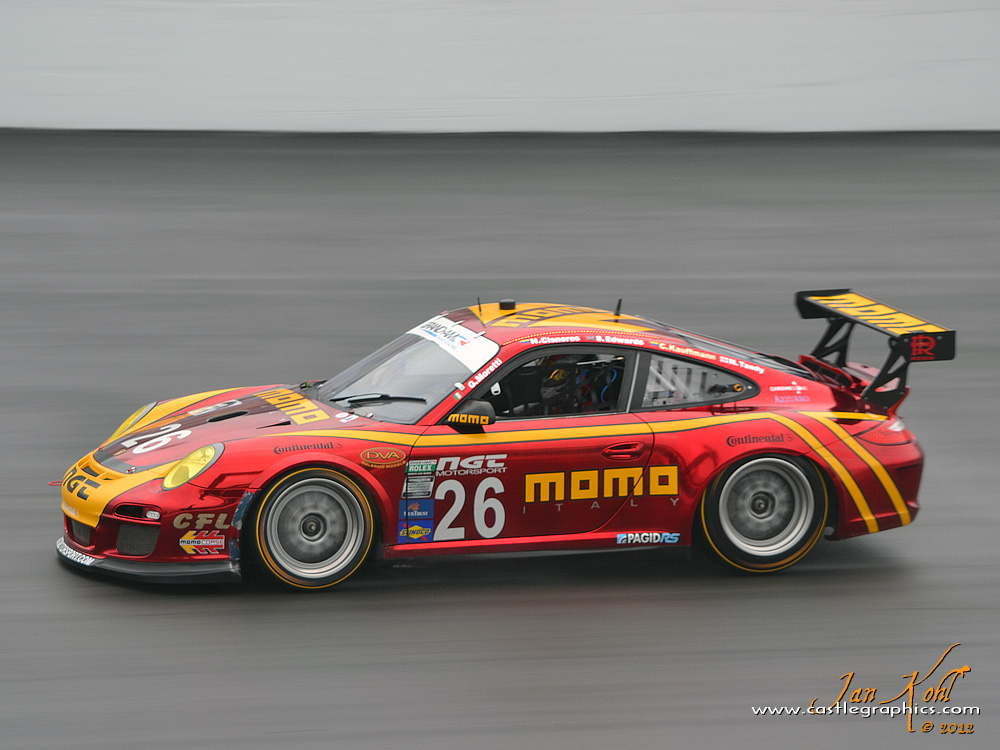 Friday Practice: 
The #26 NGT Motorsport Porsche GT3 had a cool paintscheme...a red "chrome" look.  Not best displayed in the rain, but the car still looked great.
Keywords: 2012 Rolex 24