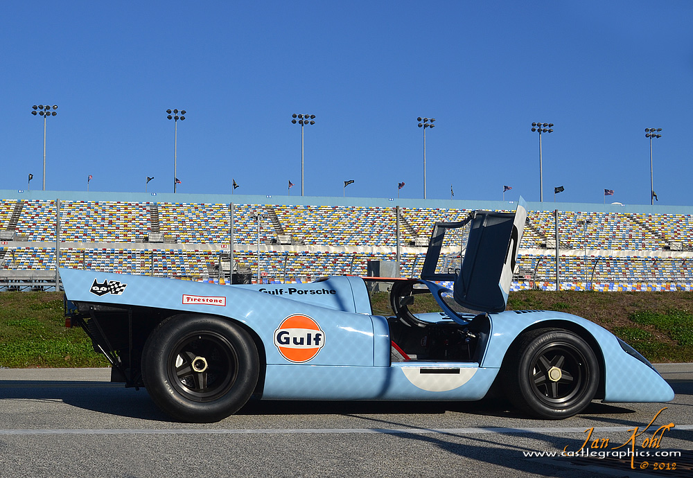 Rolex Champions Parade: Invitation
The glorious Gulf Porsche opens the door in invitation to the spectators to take a drive.
Keywords: 2012 Rolex 24