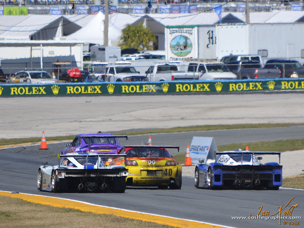 Rolex 24, Sunday: 20 hours and still racing
The two DPs fighting for the lead split a GT car going onto the banking
Keywords: 2012 Rolex 24