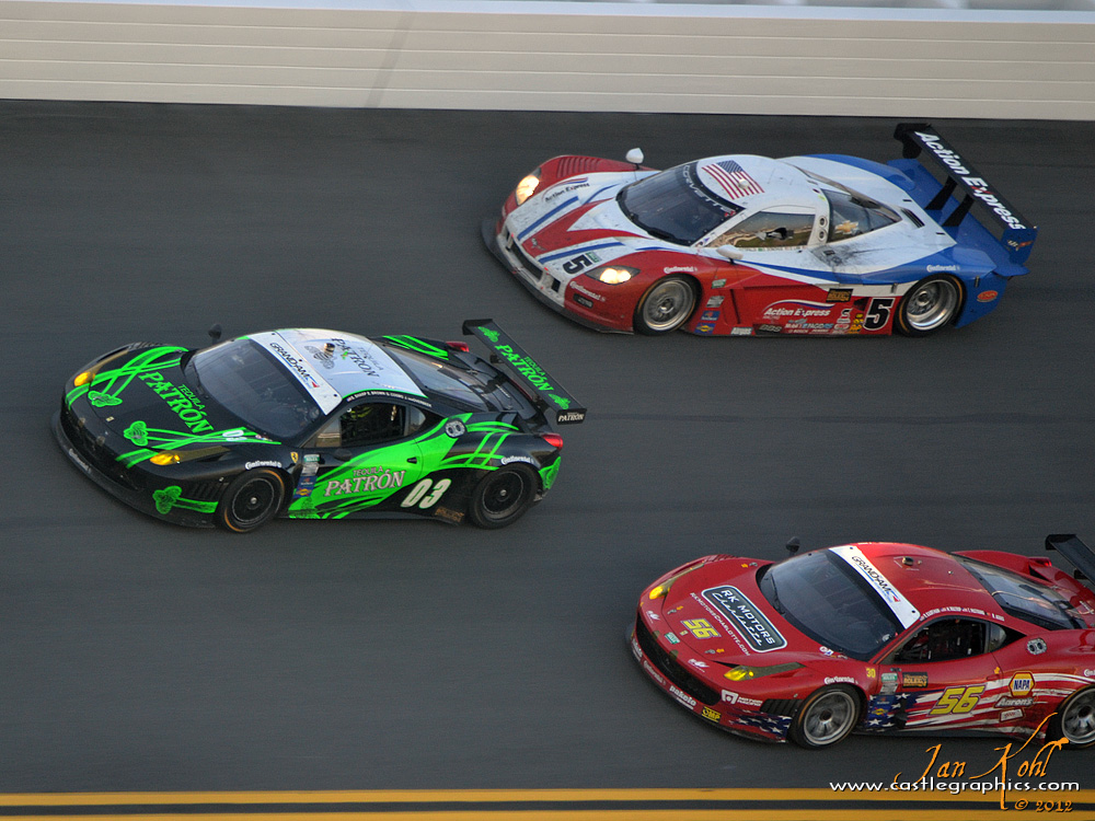 Rolex 24, Sunday: Battle of the Bank
Two Ferraris and a Corvette run closer than rush hour traffic in the 30 degree banking in turn 1.
Keywords: 2012 Rolex 24