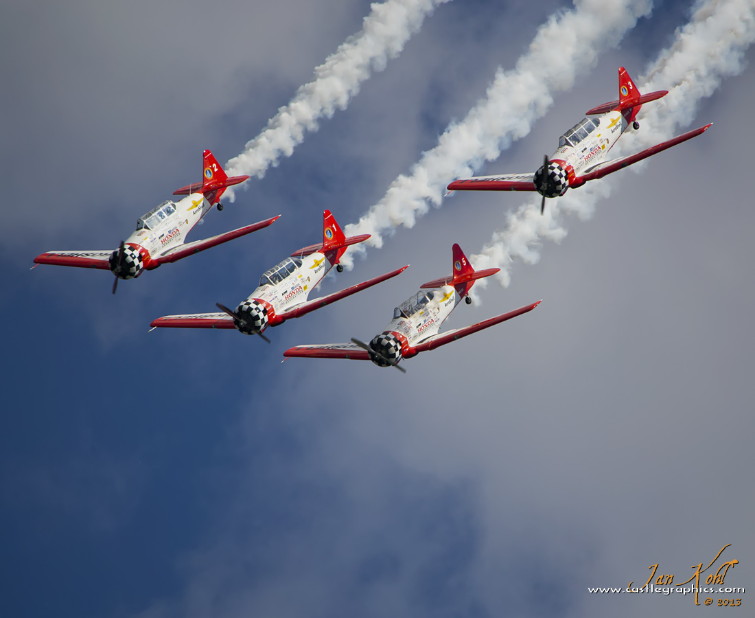 2013-09-22 8346
The Aeroshell Aerobatic Team completes a full loop for the crowd at Winston-Salem, NC
