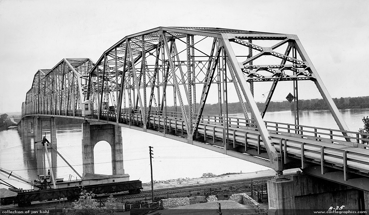 Mark Twain Memorial Bridge
This appears to be soon after the bridge was opened in 1934.  You can see two CB&Q gondolas below the bridge next to the crane.

