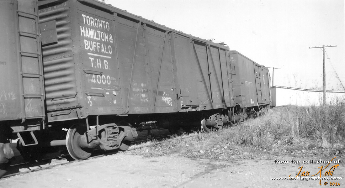 Vintage boxcars in freight train, Louisiana, MO
Nice view of a Toronto, Hamilton and Buffalo wood outside-braced boxcar on the transfer tracks between the CB&Q and GM&O.
