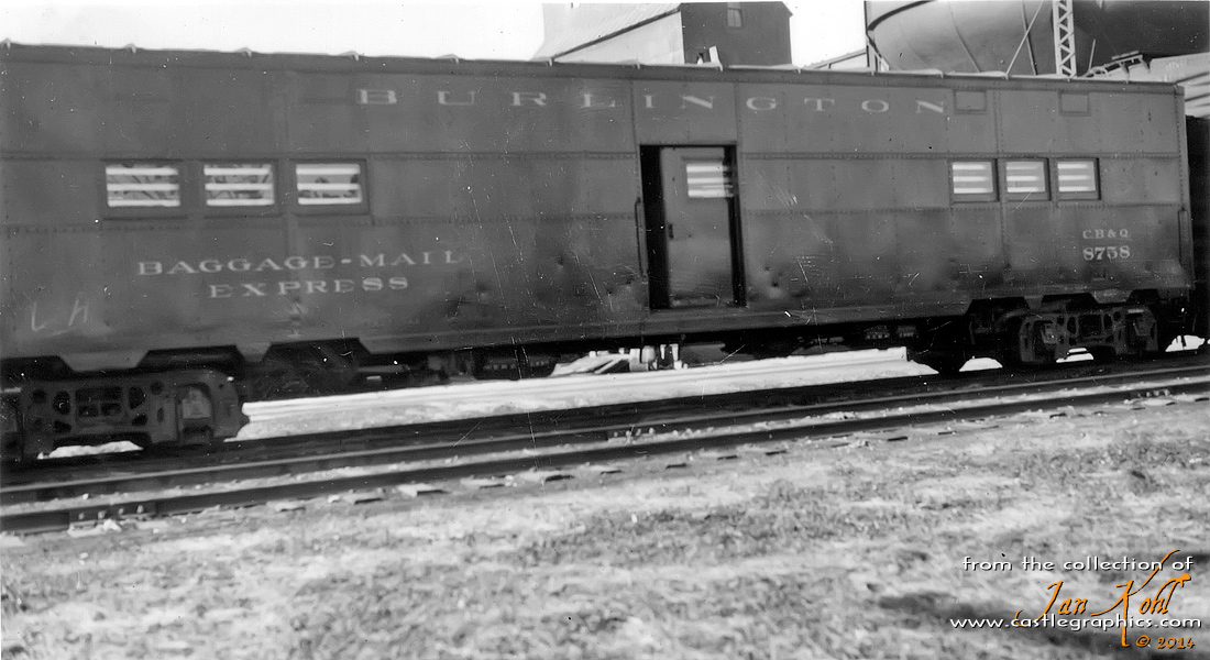 CB&Q express baggage 8758 at Louisiana, MO.
This car was an ex-WWII troop kitchen car, and was often used in Louisiana for loading trees and plants from Stark Bros Nursery.  Thanks to ex-Q railroader Archie Hayden for the info.
