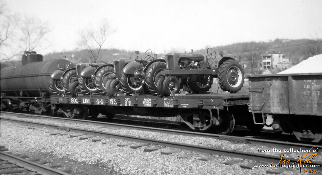 Soo Line flatcar with tractors
Nice shot of a Soo Line flatcar with a load of Allis Chalmers tractors.  This appears to be on the GM&O mainline heading west.  From Bill Hirt: Soo Line flat FM. 40' Steel Flat Car. Built 1913 by ACF. 12 cars listed in 1966 ORER. Series #4401-4479 (odd numbers only). Photo in Soo Line Freight Equipment and Cabooses on p60.

