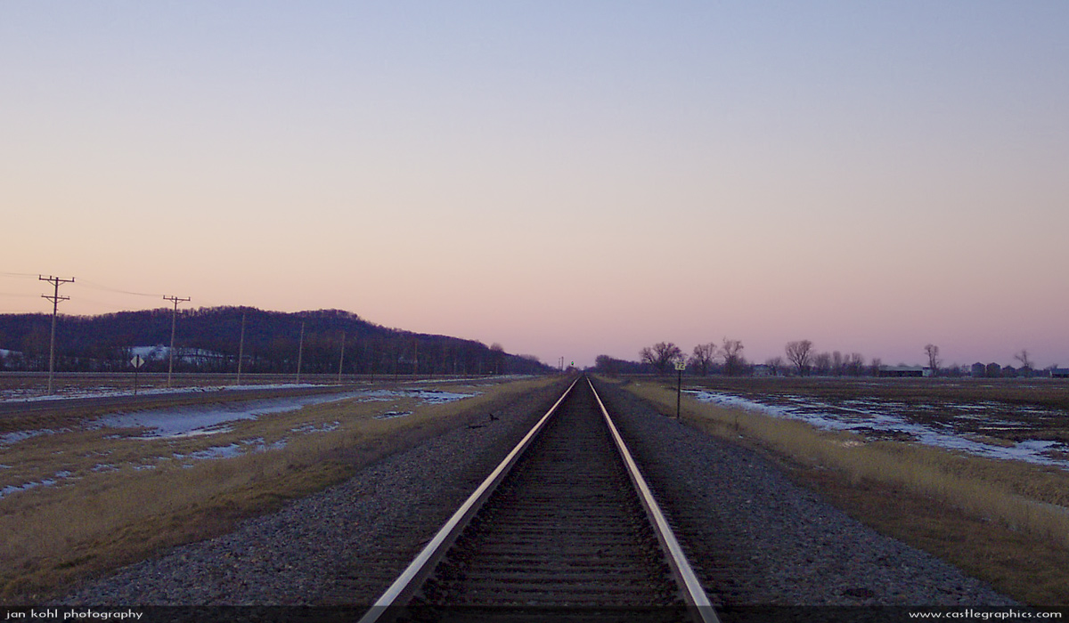 Twilight at Dameron, MO
As the last rays of the sun glint off the rails pointing to the North, its a lot easier to imagine that maybe you can still hear the shrill whistle of a Mikado echoing off the bluffs on this lonely stretch of track, or see the flashing Mars of the Mark Twain Zephyr appear around the bend.  At the very least a blinking beacon on top of a GP30 painted in Chinese Red & Gray.

But no...it's probably just imagination...
