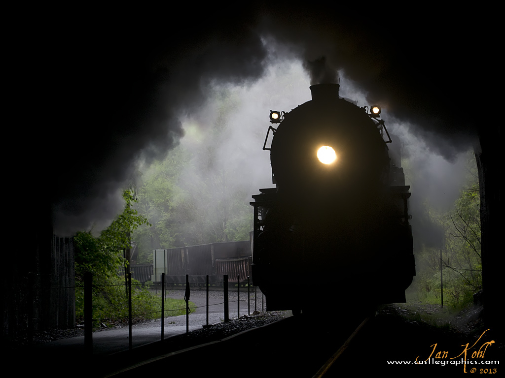 Light at the end of the tunnel...
Western Maryland #734 enters Brush tunnel on a misty day, smoke filling the tunnel...
